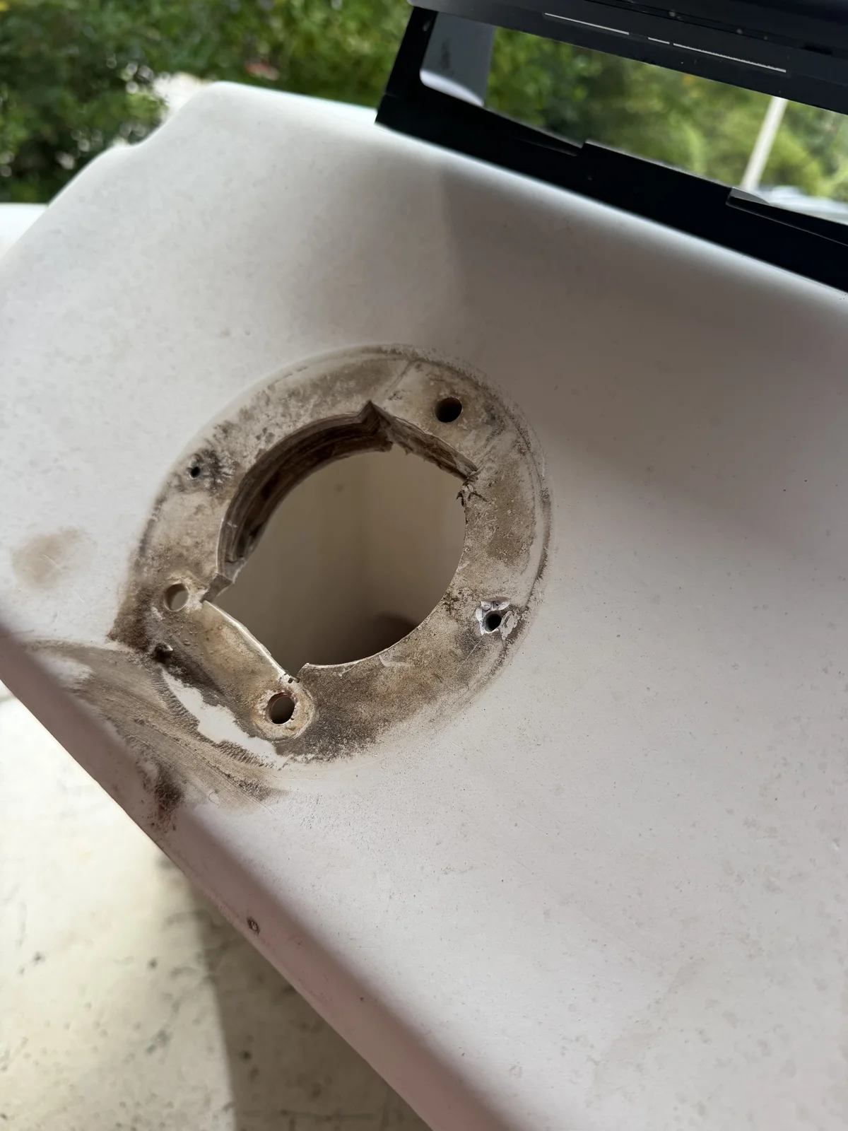 The console cutout where the old cable steering shaft passed through, ready for the new helm pump